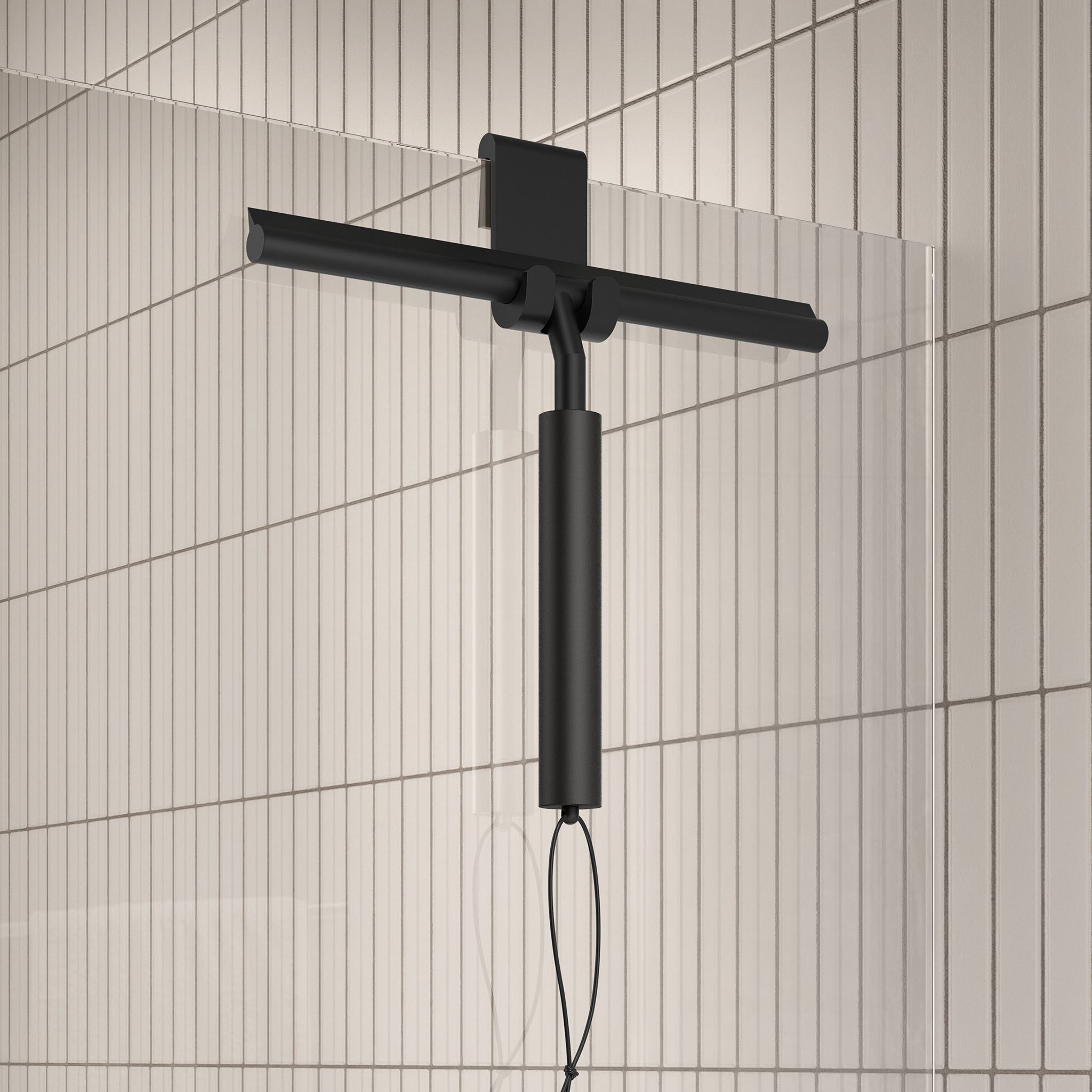 Moderner Duschabzieher Aquablade von Decor Walther in Schwarz matt, reduziertes Design mit ausziehbarem Griff und bohrfreier Silikonhalterung.